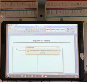 A Promethean interactive whiteboard displaying an experiment.