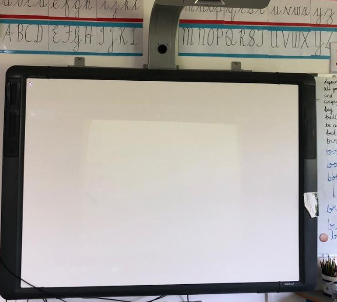 A classroom with a Promethean Activboard in use